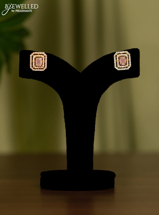 Zircon earrings with baby pink and cz stones in gold finish