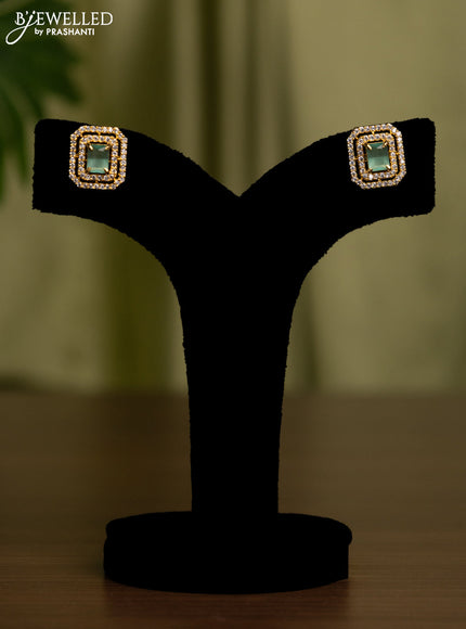 Zircon earrings with mint green and cz stones in gold finish