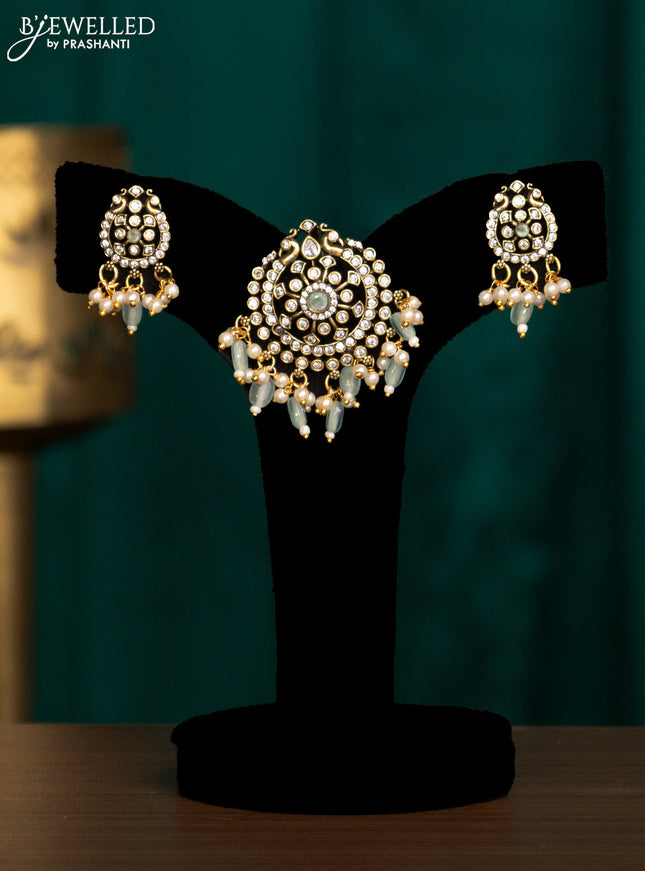 Pendant set with mint green & cz stones and beads hanging in victorian finish