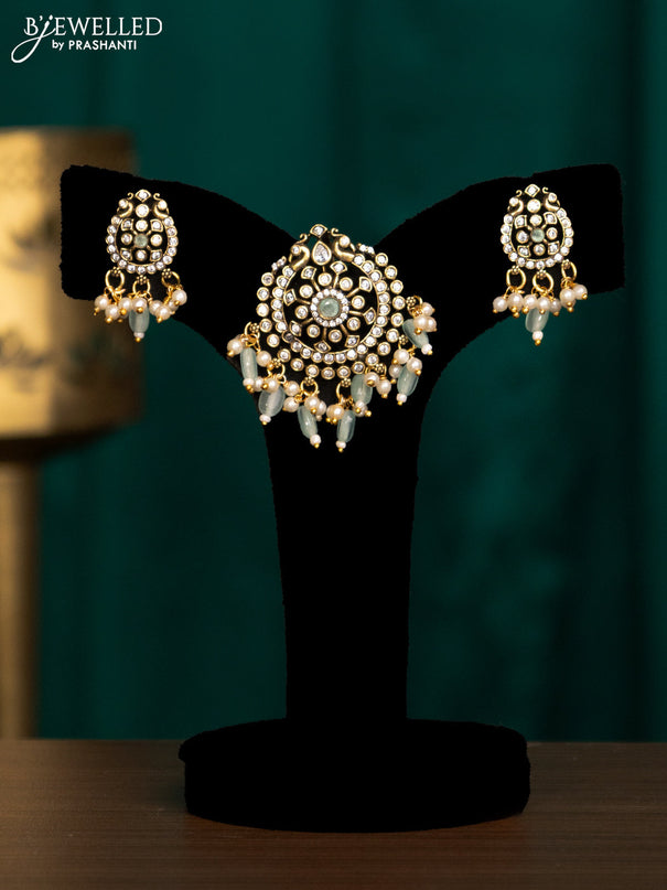 Pendant set with mint green & cz stones and beads hanging in victorian finish
