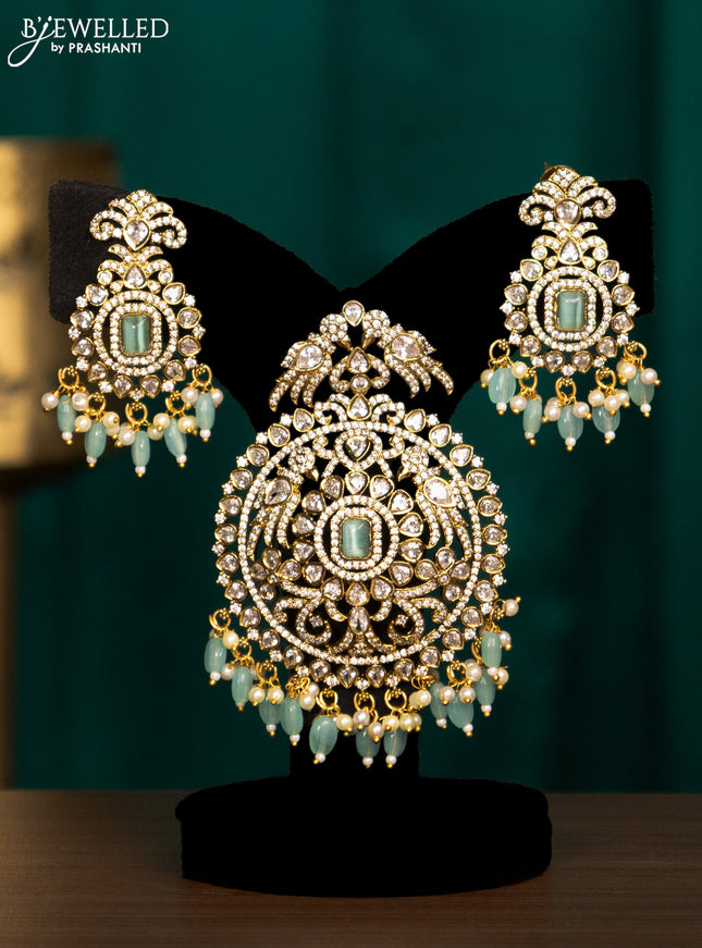 Pendant set with mint green & cz stones and beads hanging in victorian finish