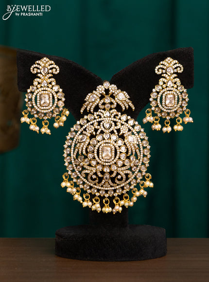 Pendant set with cz stones and beads hanging in victorian finish