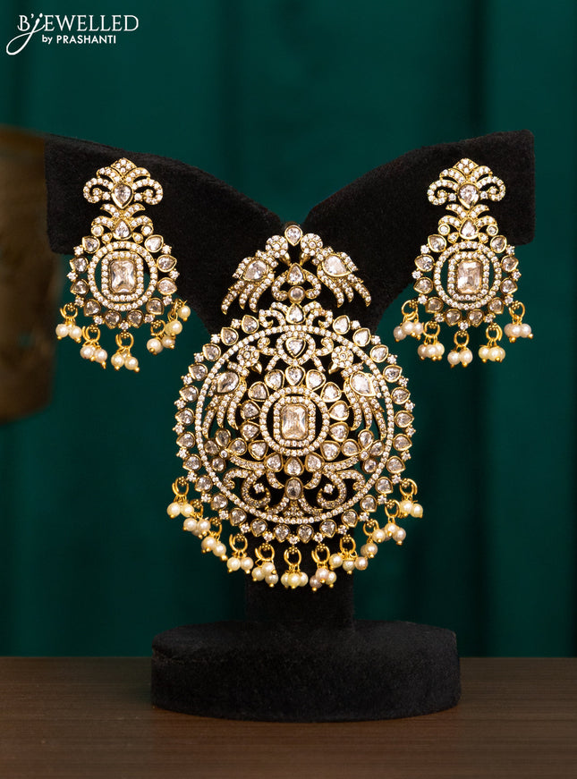 Pendant set with cz stones and beads hanging in victorian finish