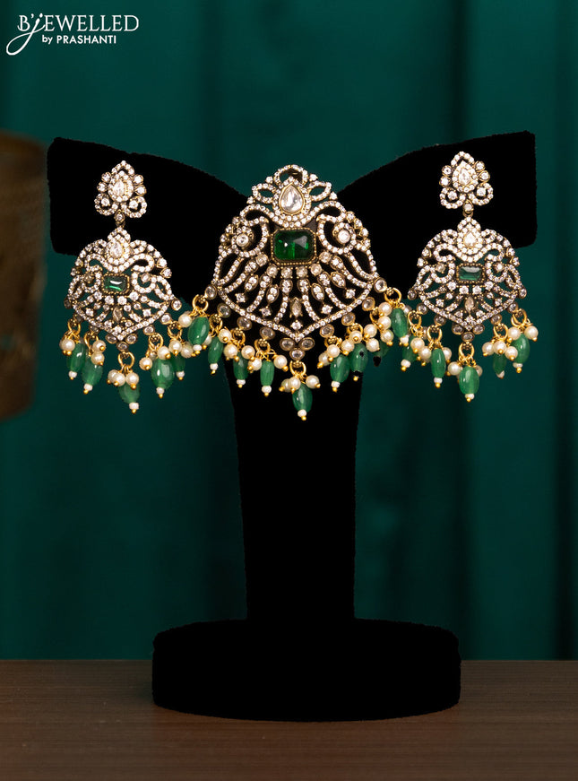 Pendant set with emerald & cz stones and beads hanging in victorian finish