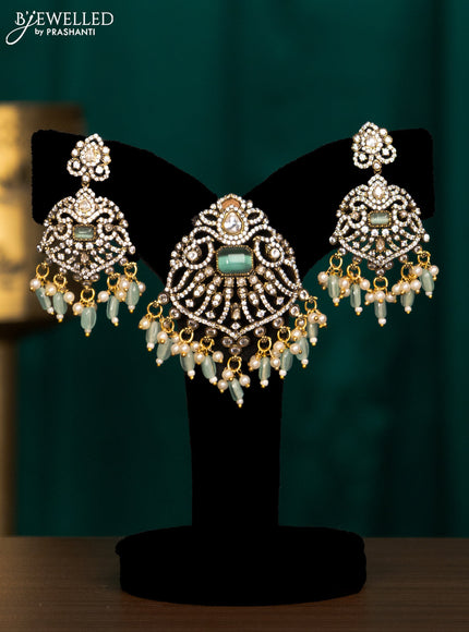 Pendant set with mint green & cz stones and beads hanging in victorian finish