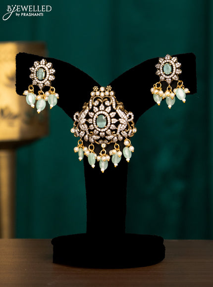 Pendant set with mint green & cz stones and beads hanging in victorian finish