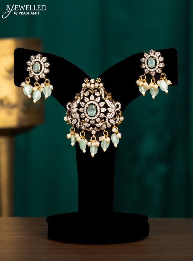 Pendant set with mint green & cz stones and beads hanging in victorian finish