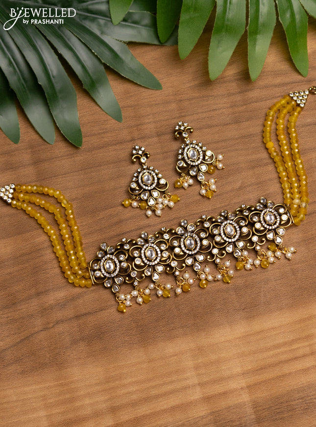 Beaded yellow choker with kundan & cz stones and beads hanging in victorian finish