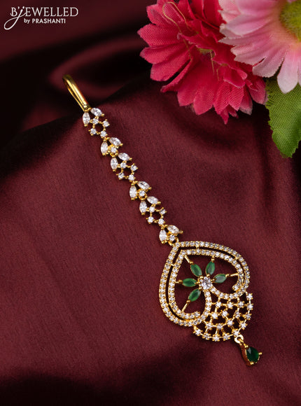 Zircon maang tikka with emerald & cz stones in gold finish