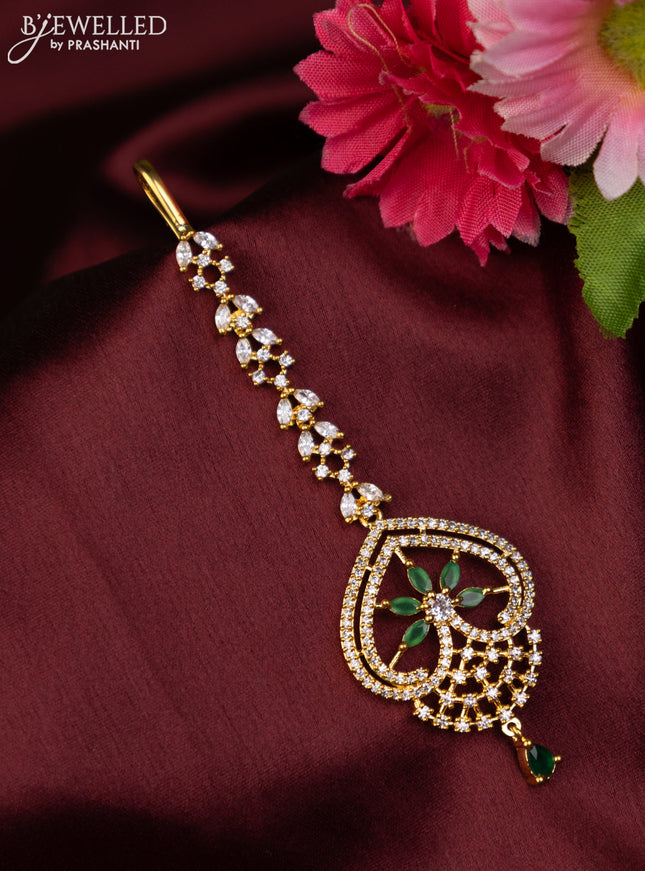 Zircon maang tikka with emerald & cz stones in gold finish