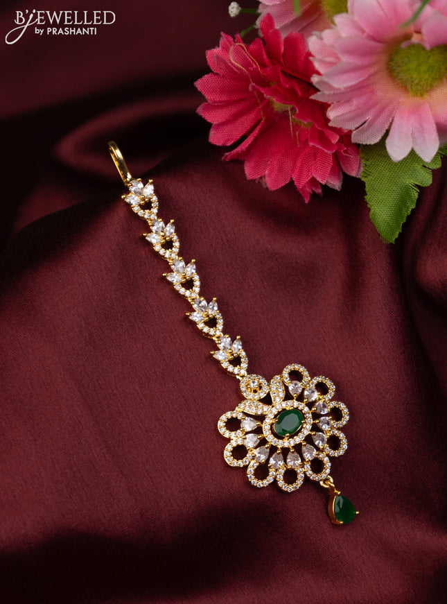 Zircon maang tikka with emerald & cz stones in gold finish and hanging