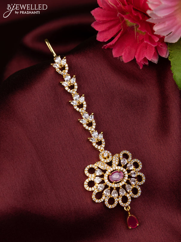Zircon maang tikka with ruby & cz stones and hangings in gold finish