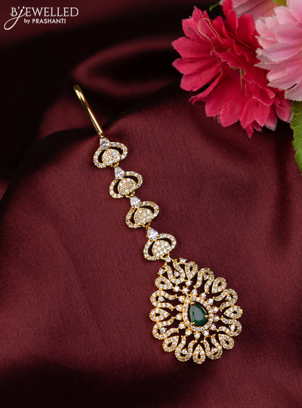 Zircon maang tikka with emerald & cz stones in gold finish