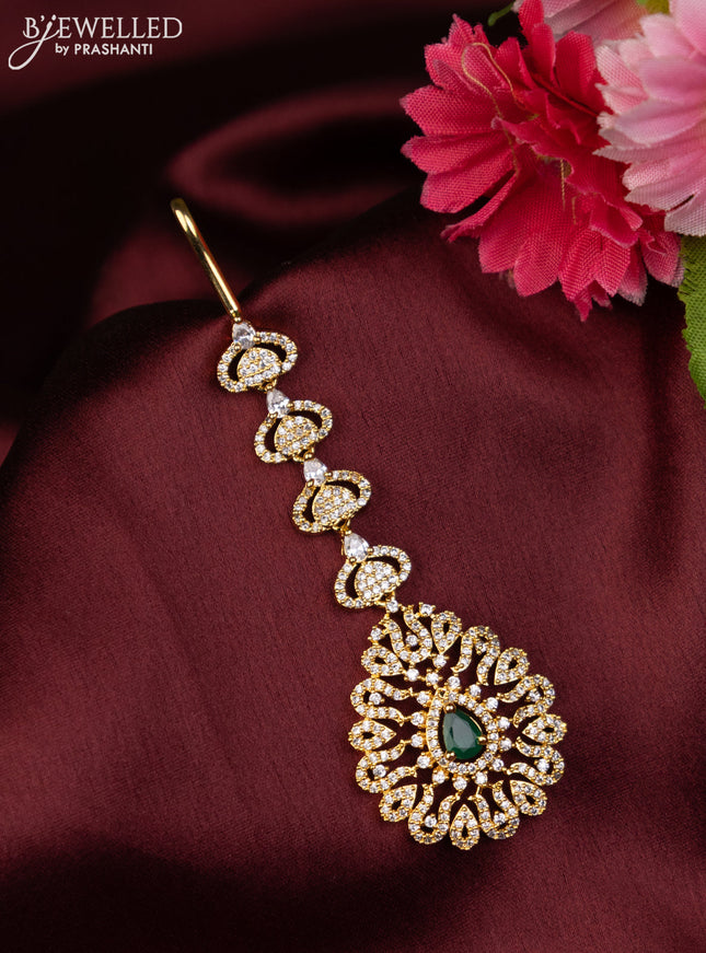 Zircon maang tikka with emerald & cz stones in gold finish
