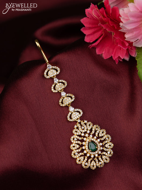 Zircon maang tikka with emerald & cz stones in gold finish