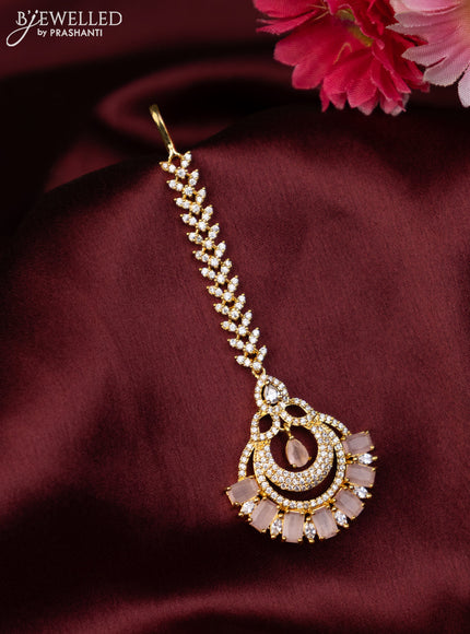 Zircon maang tikka with baby pink & cz stones in gold finish