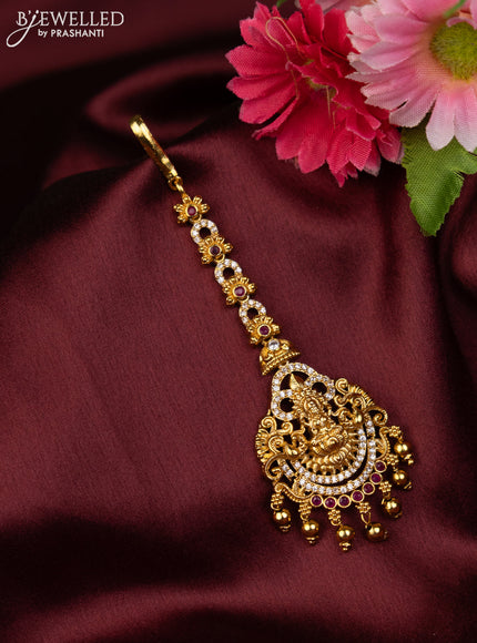 Antique maang tikka lakshmi design with pink kemp & cz stones and golden beads hanging