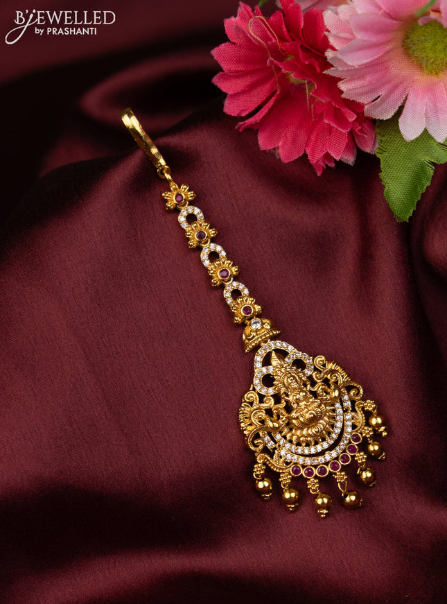 Antique maang tikka lakshmi design with pink kemp & cz stones and golden beads hanging