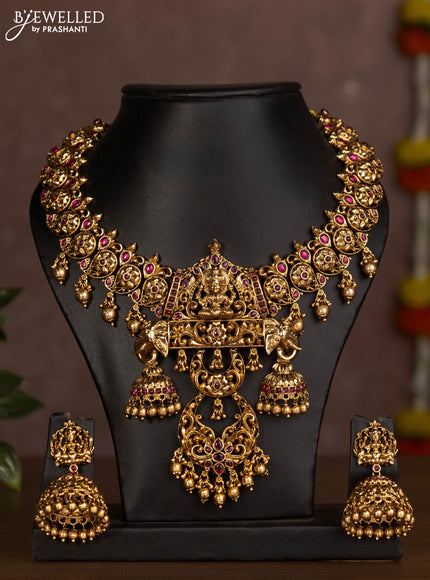 Antique necklace lakshmi design with pink jadau stones and golden beads hanging