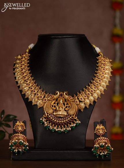 Antique necklace lakshmi kasu design with pink jadau stones and green beads hanging
