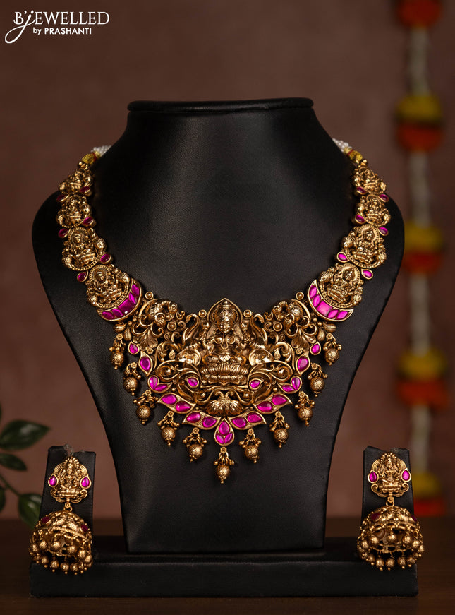 Antique necklace lakshmi design with pink jadau stones and golden beads hanging
