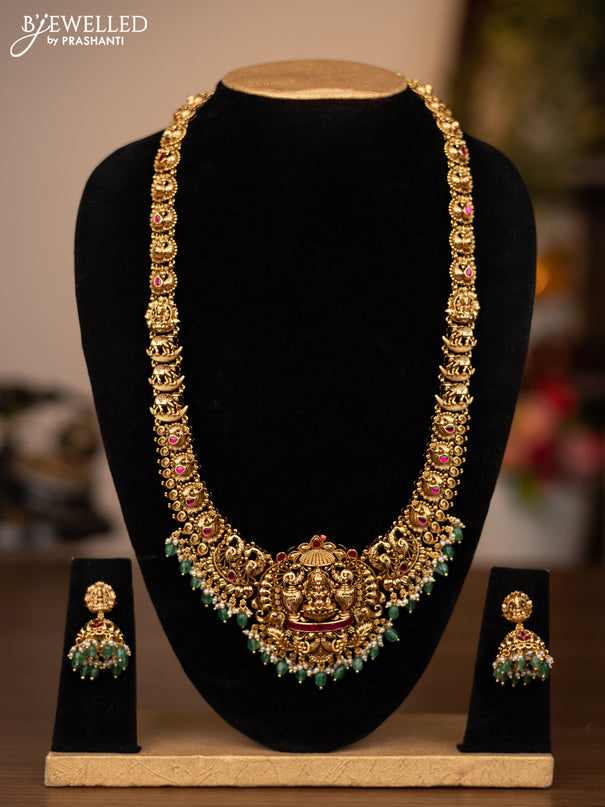 Antique haaram lakshmi design with pink jadau stones and green beads hanging