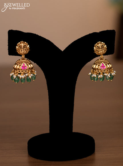 Antique haaram lakshmi design with pink jadau stones and green beads hanging