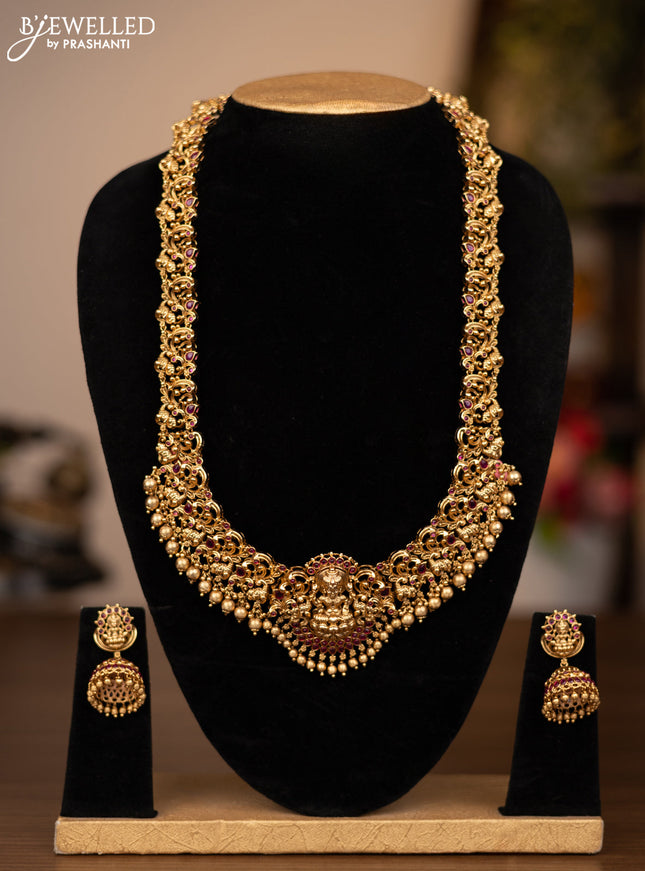 Antique haaram lakshmi design with pink kemp stones and golden beads hanging