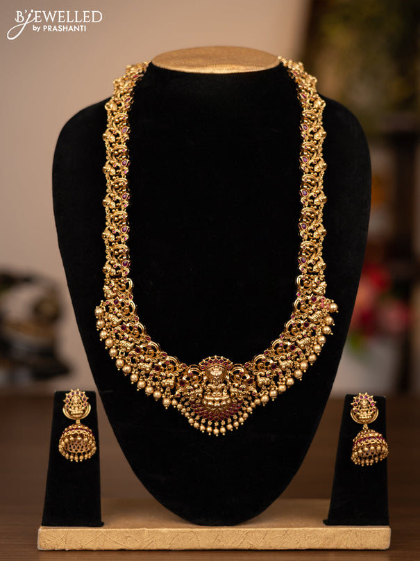 Antique haaram lakshmi design with pink kemp stones and golden beads hanging