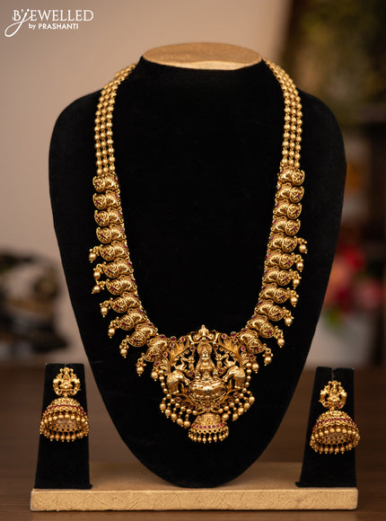 Antique haaram lakshmi design with pink kemp stones and golden beads hanging