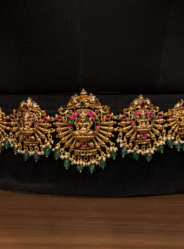 Antique bridal set lakshmi design with jadau stones and green beads hanging
