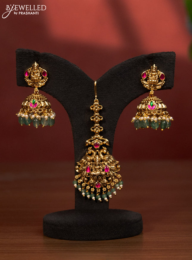 Antique bridal set lakshmi design with jadau stones and green beads hanging