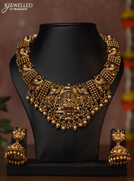 Antique necklace lakshmi design with pink kemp stones and golden beads hanging