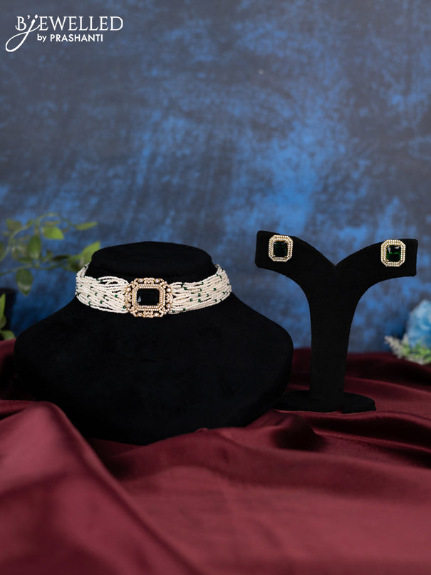 Pearl choker with emerald and cz stones