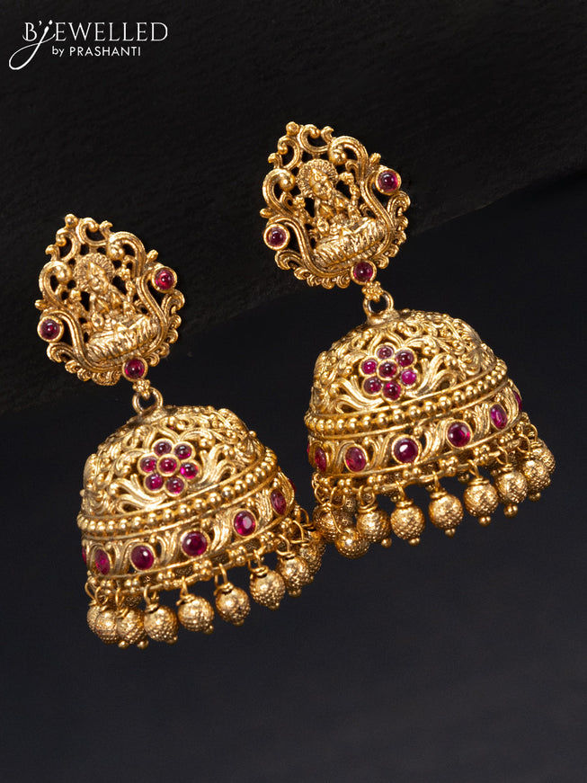 Antique jhumka lakshmi design with pink kemp stones and golden beads hangings