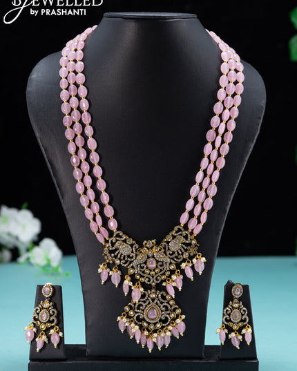 Beaded baby pink necklace with cz stones and beades hanging in victorian finish