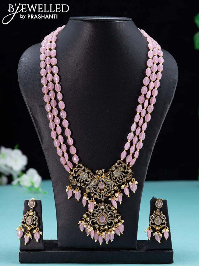Beaded baby pink necklace with cz stones and beades hanging in victorian finish