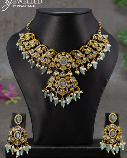 Necklace peacock design with mint green & cz stones and beads hanging in victorian finish