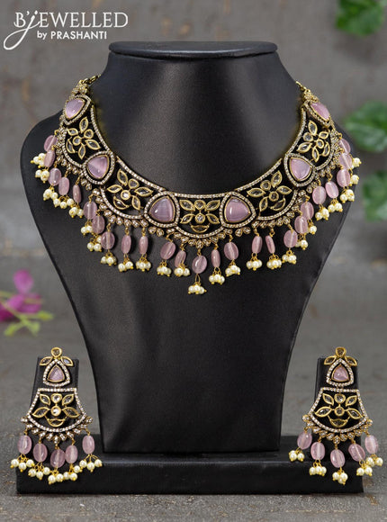 Necklace with baby pink & cz stones and beads hanging in victorian finish