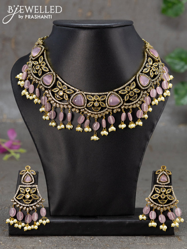 Necklace with baby pink & cz stones and beads hanging in victorian finish