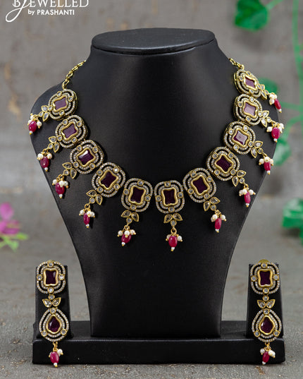 Necklace with pink kemp & cz stones and beads hanging in victorian finish