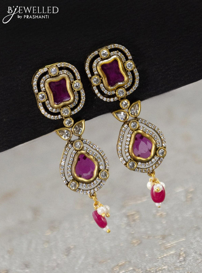 Necklace with pink kemp & cz stones and beads hanging in victorian finish