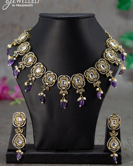 Necklace with violet & cz stones and beads hanging in victorian finish