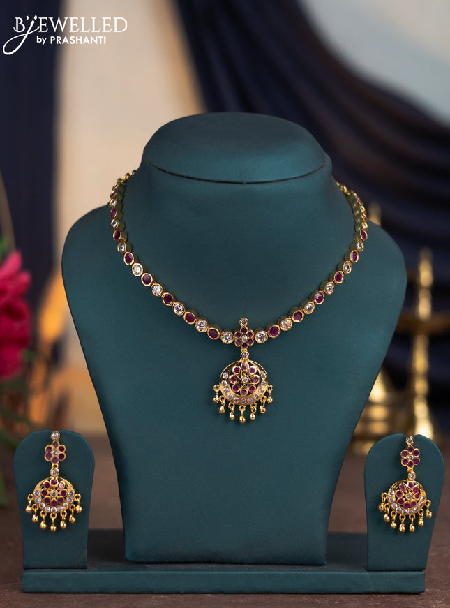 Attigai necklace with ruby & cz stones and golden beads hangings in gold finish