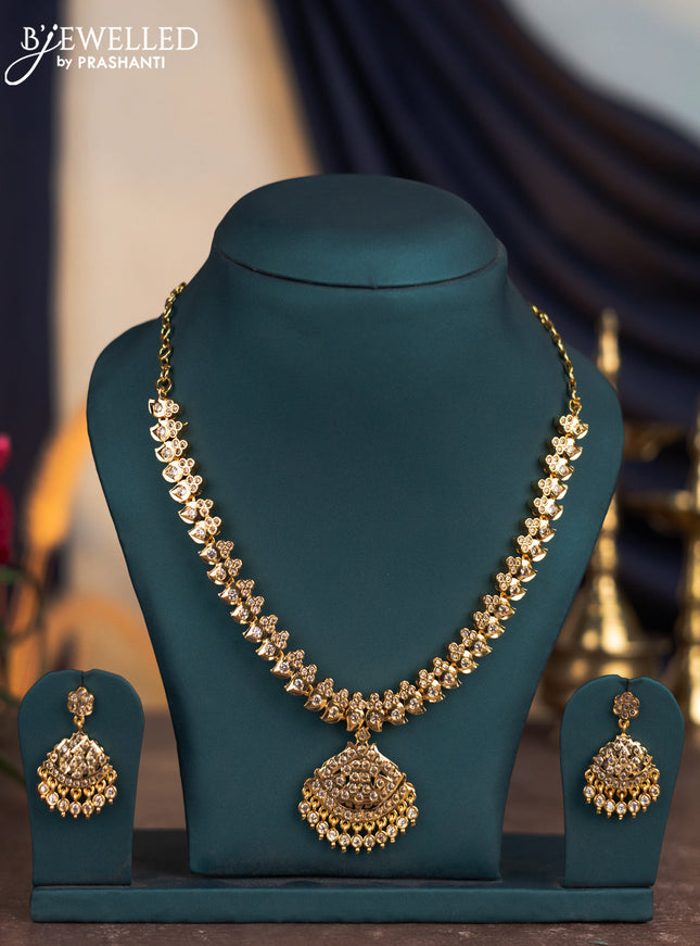 Attigai necklace manga pattern with cz stones and hangings in gold finish