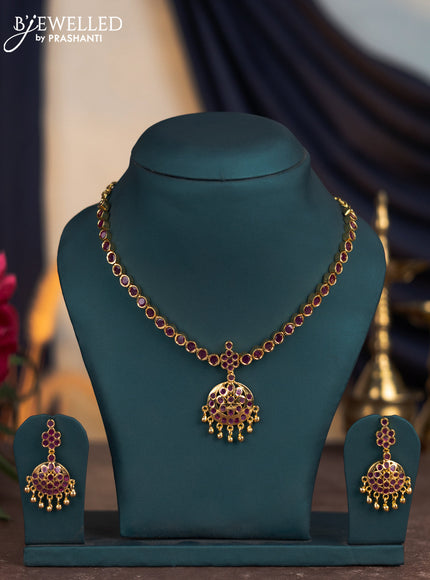 Attigai necklace with ruby stones and golden beads hangings in gold finish