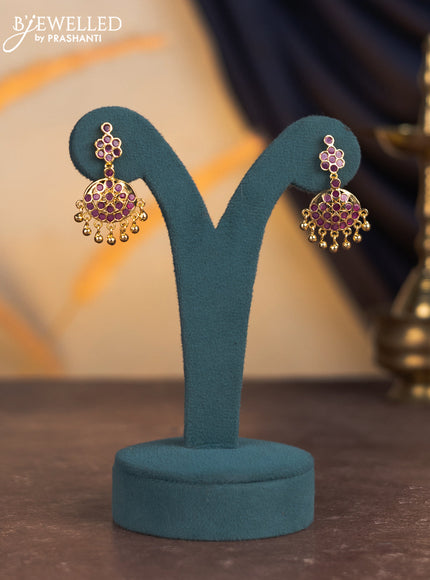 Attigai necklace with ruby stones and golden beads hangings in gold finish