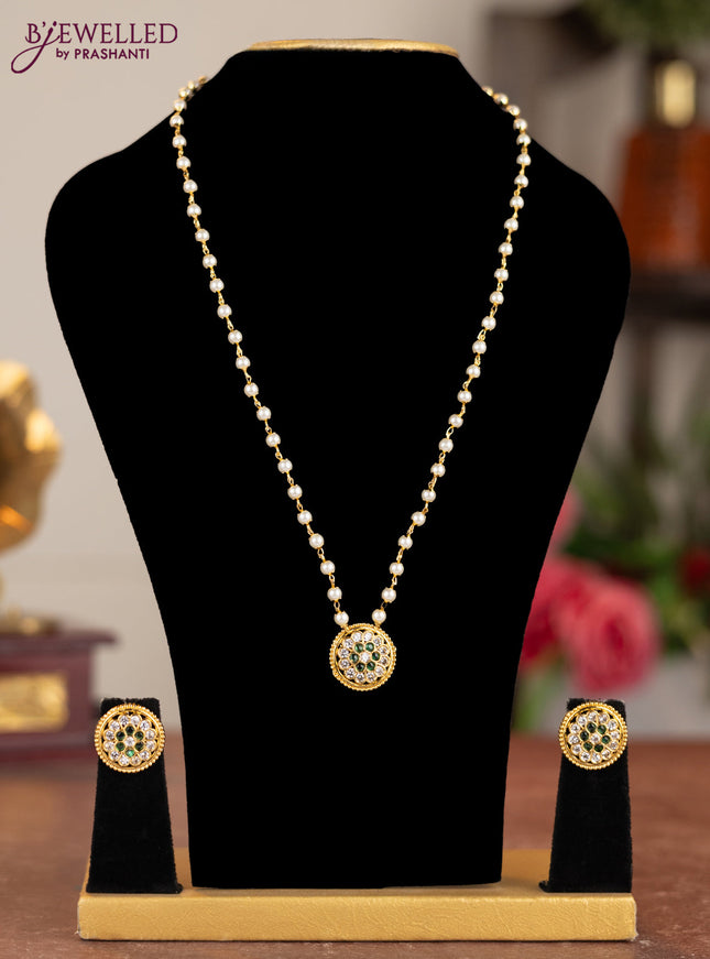 Pearl necklace with emerald and cz stones