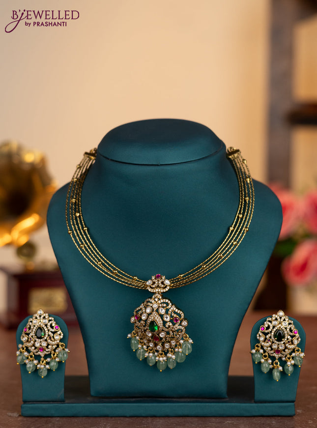 Antique ring type choker lakshmi pendant with kemp & kundan cz stones and pearl & mint green beads hangings