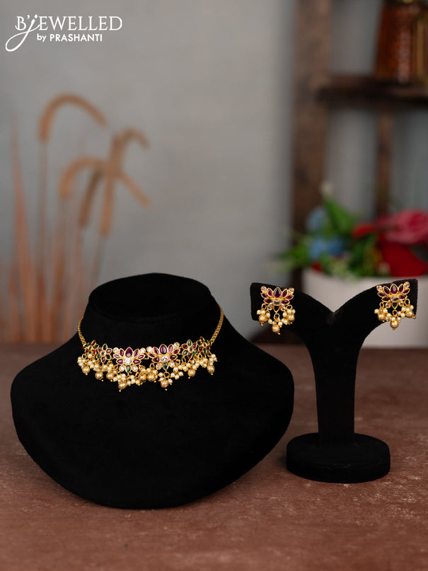 Antique choker lotus design with kemp & cz stones and pearl & golden beads hangings